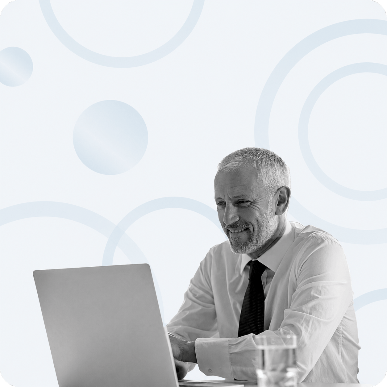 Male-reading-whitepaper-on-laptop-office